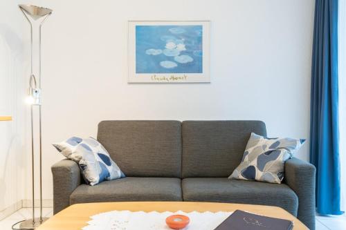 a living room with a couch and a table at Haus Roland, Wohnung 03 in Zinnowitz