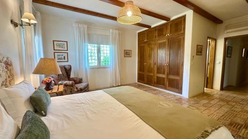 a bedroom with a large white bed in a room at Sol - Private Pool - 14 Guests - Vilamoura in Vilamoura
