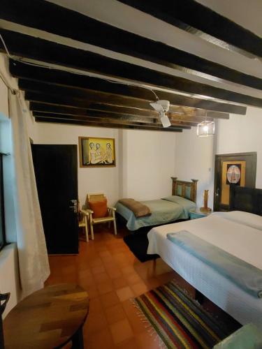 a bedroom with two beds in a room at Casa xocolatl in San Miguel de Allende