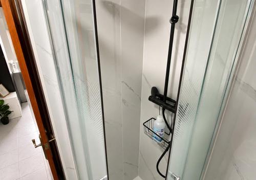 a shower with a glass door in a bathroom at Estudio Torreblanca in Torrevieja