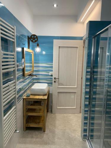 a bathroom with a sink and a shower at Tra Cielo e Mare - Monopoli in Impalata