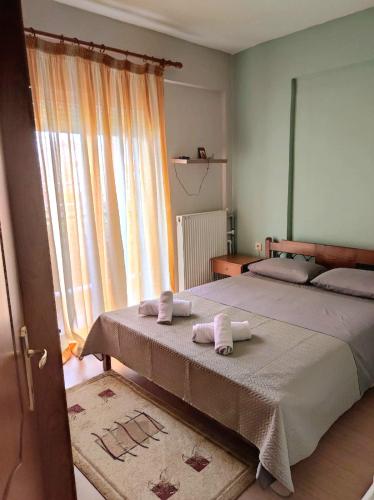 a bedroom with two beds with towels on them at GiannisHouse in Florina