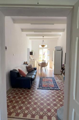 a living room with a couch and a table at 458 - Favlyn Boutique Apartments in Sliema