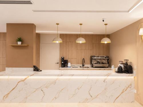 a kitchen with a large white marble counter top at Jwana in Riyadh