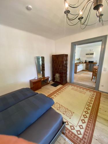a bedroom with a bed and a living room at Bavaria One in Cincu