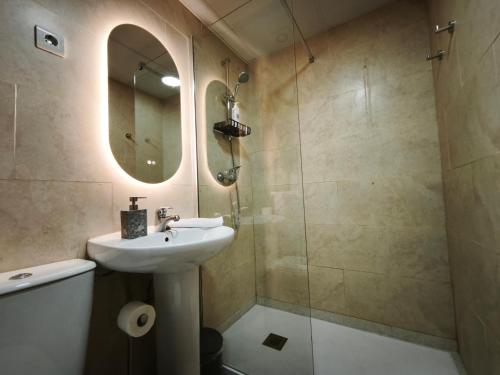 a bathroom with a sink and a shower at AC Apartaments Centre in Pas de la Casa