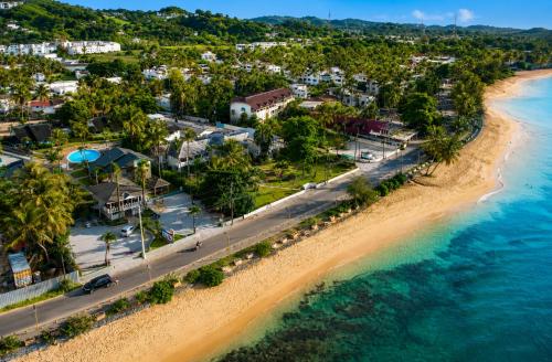 an aerial view of a beach in a resort at Villas Palmar Residence Beachfront Villas & Studios in Las Terrenas