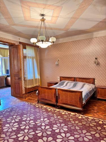 a bedroom with a bed in a room with a ceiling at Kolagis Marani in Kolagi