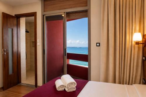 a hotel room with a view of the ocean at Dakhla Sur Mer Hôtel in Dakhla