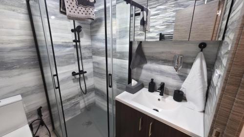 a bathroom with a shower and a sink at Lovely Holiday in Alicante