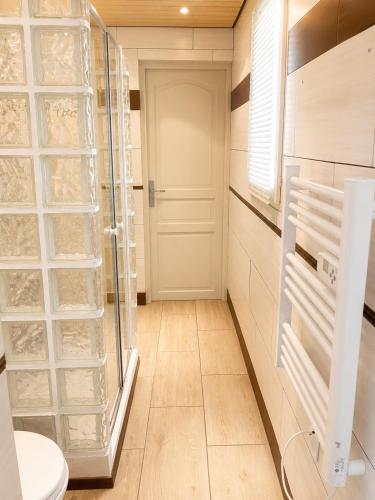 a bathroom with a glass shower and a toilet at villa plaisirs in Saint Paul de Vence