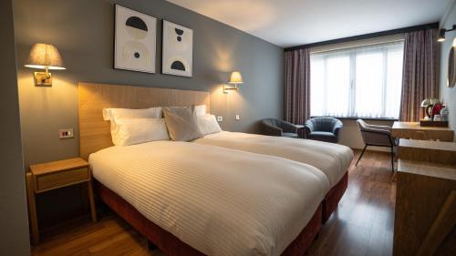 Llit o llits en una habitació de Bedford Hotel Brussels