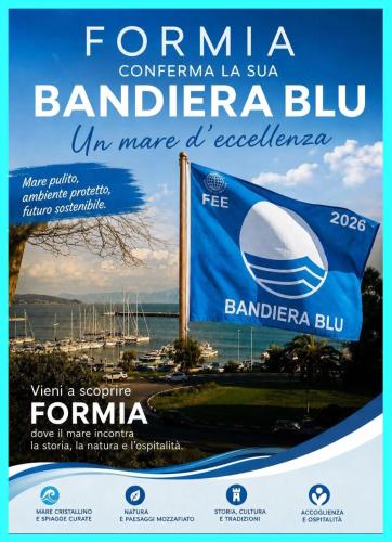 a poster for a bmw dealership with a banner at Casa Vacanze Formia in Formia
