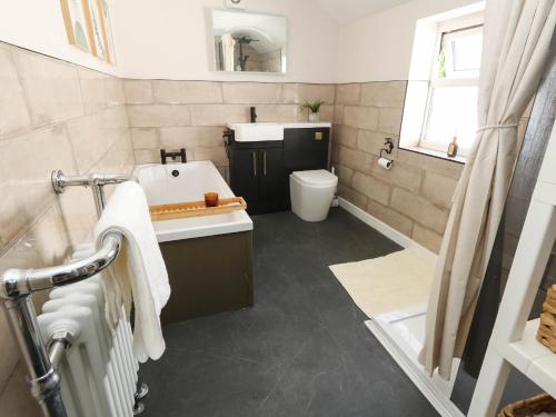 a bathroom with a sink and a toilet at The Watch House in Weymouth