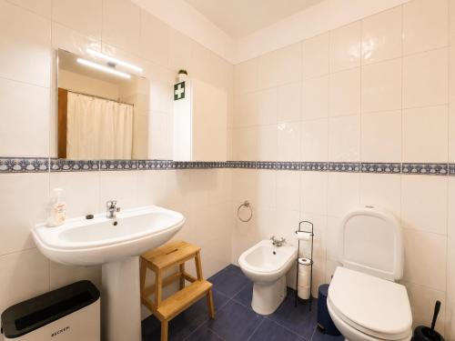 a bathroom with a sink and a toilet at Studio Gerês in Geres