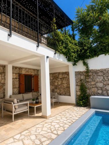a villa with a swimming pool and a house at Villa "Lala" in Ljubuški