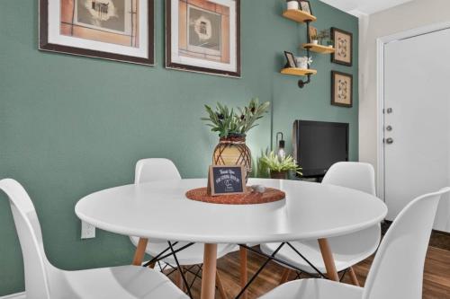 a white dining room with a white table and chairs at Casa Oasis Temple 3BR 2BA Work Ready in Temple