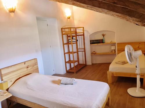 a room with two beds and a ladder in it at Kortijo Martzala in Lucainena de las Torres