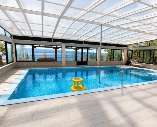 a large swimming pool with a glass ceiling at Villas Verde Dalmatia in Jesenice