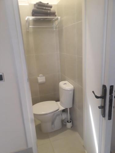 a bathroom with a toilet in a small room at La Maison Nature , Mountains View Suite in Ourika