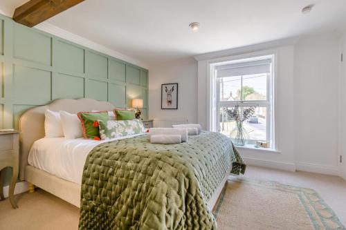 a bedroom with a large bed and a window at 4 Bed in East Rudham oc-t28312 in East Rudham