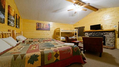 a bedroom with a bed and a fireplace at Arrowhead 05 in Red River