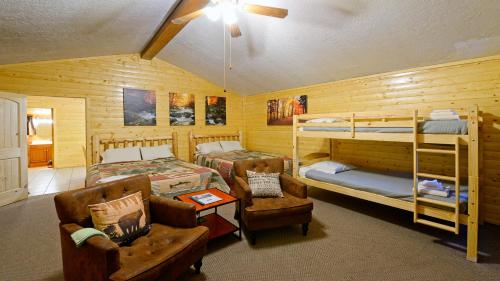a bedroom with two bunk beds and a couch at Arrowhead 05 in Red River