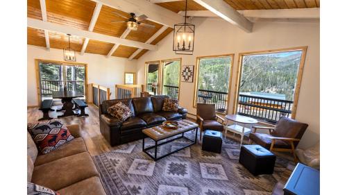a living room with a couch and a table at Aspen Hideaway in Red River