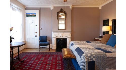 a bedroom with a bed and a fireplace at Waite Phillips in Cimarron