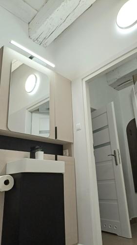 a bathroom with a sink and a mirror at #RYNEK stare miasto MKVADRAT in Lublin