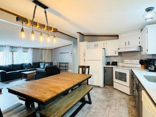 a kitchen and a living room with a wooden table at Put-in-Bay Island Club #71 in Put-in-Bay