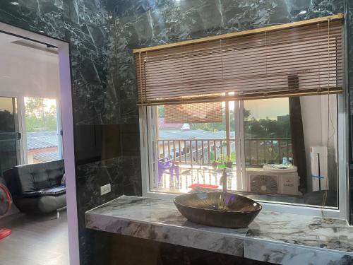 a bowl on a counter in front of a window at Ocean View Tuggi Klong Prao in Klong Prao Beach