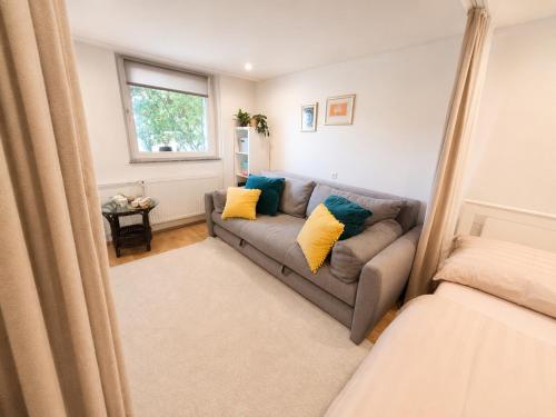 a living room with a couch and a window at Grandma's Corner in Štore