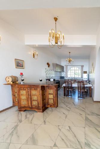 a large kitchen and dining room with a dining table at White Hill Penthouse in Kisumu