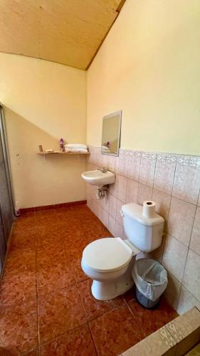 a bathroom with a toilet and a sink at Accommodation #7 in Copán Ruinas
