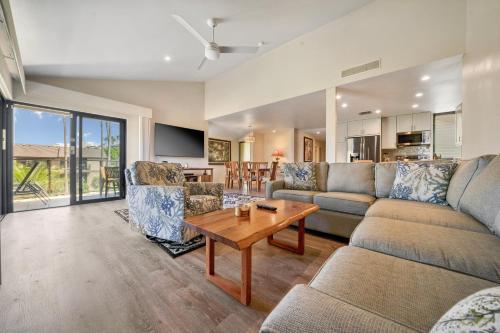 a living room with a couch and a table at WAILEA ELUA, #1104 in Wailea