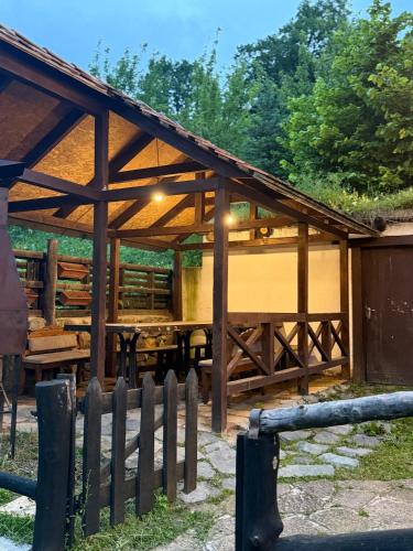 a wooden pavilion with a fence in front of it at Zartak cottage in Dilijan