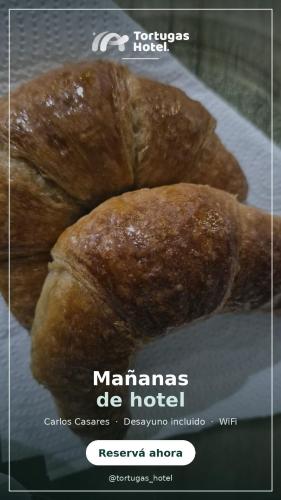 a poster for a matanzas de hotel with two rolls at Tortugas Hotel in Carlos Casares