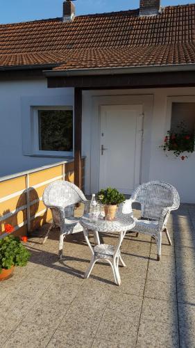 a table and two chairs on a patio at BellaCaro in Löhne