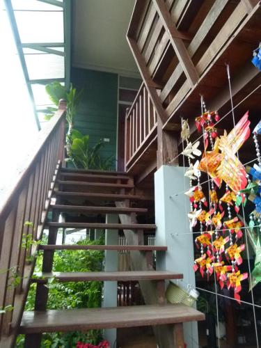 a staircase in a house with a bunch of shoes at Ban Boonchu in Phra Nakhon Si Ayutthaya