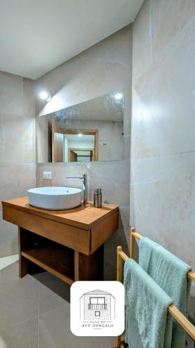 a bathroom with a sink and a mirror at Casa do Avô Gonçalo in Mogadouro