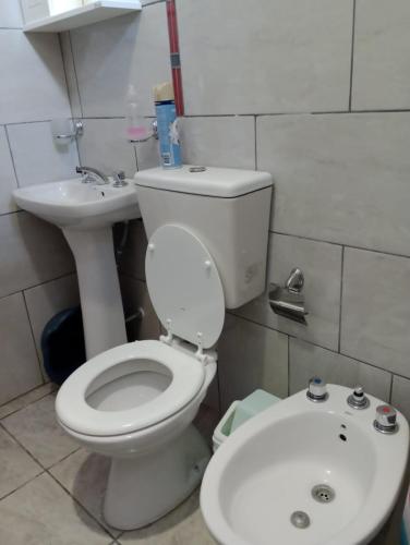 a bathroom with a toilet and a sink at Alojamientos Rinconcito don Antonio casa in Tinogasta