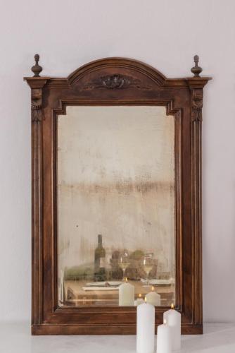 a picture of a room with candles in a frame at Kastro Mansion in Pirgos