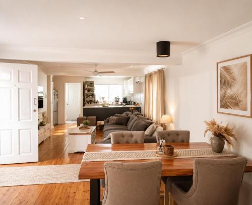 a living room with a table and a couch at Gosford Retreat in Gosford
