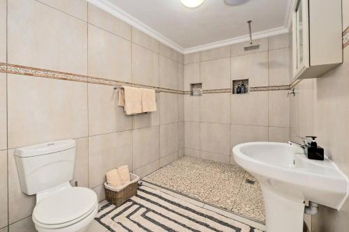 a bathroom with a toilet and a sink at Coast Unit 5, Bright Escape By Langebaan Lagoon in Langebaan