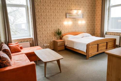 Postel nebo postele na pokoji v ubytování Guest House Senasis Pastas