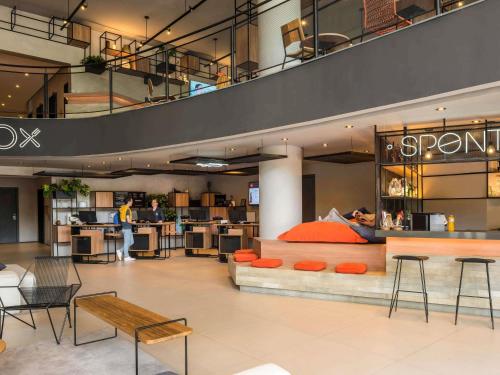 a store with a bed in the middle of a building at ibis Sao Paulo Barra Funda in São Paulo