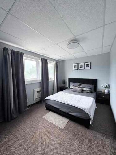 a bedroom with a large bed in a room at 2806 Regina in Regina