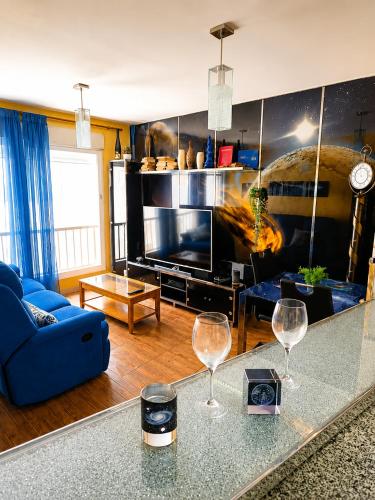 a living room with two wine glasses on a table at Romantic - Garaje Incluido & ApartamentosAltea in Altea