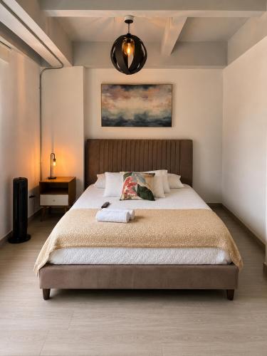 a bedroom with a large bed in a room at Lovely Private Apto in Poblado in Medellín
